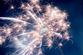 A few volleys of festive fireworks in the night sky, red-yellow. Royalty Free Stock Photo