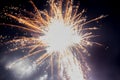 A few volleys of festive fireworks in the night sky, red-yellow. Royalty Free Stock Photo