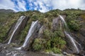 Multiple small waterfalls from the cliff to the valley