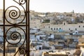 Fez medina seen through decorated in arabic style window, Morocco, North africa