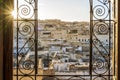 Fez medina seen through decorated in arabic style window, Morocco, North africa