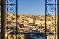 Fez medina seen through riad`s window with decorative grate, Morocco, Africa