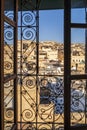 Fez medina seen through riad`s window with decorative grate, Morocco, Africa