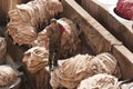 FEZ, MOROCCO - FEBRUARY 20, 2017: Man working within the paint holes at the famous Chouara Tannery in the medina of Fez. Royalty Free Stock Photo