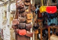 Fez, Morocco - January 07, 2020: Handmade colourful leather bags and purses hanging on display at traditional souk - street market