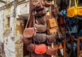 Fez, Morocco - January 07, 2020: Handmade colourful leather bags and purses hanging on display at traditional souk - street market