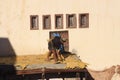 Fez, Morocco - January 01, 2010: Workers are dyeing and tanning leather at the tannery in Fez using the traditional Royalty Free Stock Photo