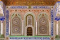 FEZ, MOROCCO - JUNE 02, 2017: Outer wall of the mausoleum of Moulay Idris II who ruled Morocco in IX c. with a grilled window to Royalty Free Stock Photo