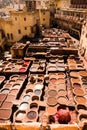 Fez, Morocco - March 9, 2018: View of stone vessels with dyes and leathers in a traditional tannery in the city of Fez, Morocco