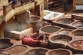 FEZ, MOROCCO - MAY 31, 2017: Unknown woker in the tannery in Fez. The tanning industry in the city is considered one of the main Royalty Free Stock Photo