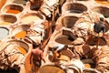 Fez Tanneries Working Process - The iconic tannery in Fez, Morocco, with workers dyeing leather in the pits under the strong Royalty Free Stock Photo