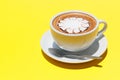 Coffee cup of hot latte art on Yellow background Royalty Free Stock Photo