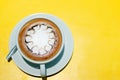 Ffee cup of hot latte art on Yellow background Royalty Free Stock Photo