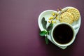 FFlatlay A cup of coffee and two small round delicious cookies on a saucer in the shape of a heart Royalty Free Stock Photo