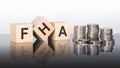 FHA - text is made up of letters on wooden cubes lying on a mirror surface Royalty Free Stock Photo