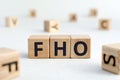 FHO - acronym from wooden blocks with letters