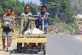 Unknown boys carries a traditional caresa carriage