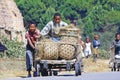 Unknown boys carries a traditional caresa carriage