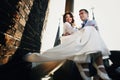 Fiance twist bride while holding her in his arms on the rooftop Royalty Free Stock Photo