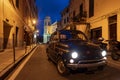 Classic car cruising on the road Royalty Free Stock Photo