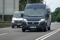 Fiat Ducato delivery van on 4-lane road with slight motion blur effect