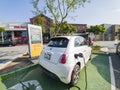 The Fiat 500e Electric Vehicle is charging at the station