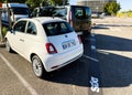 Fiat mini italian car in parking with Sixt car rental company logotype on