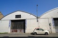 Fiat 500 new model parked in front of workshop Royalty Free Stock Photo