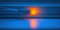 Fiber optic cable illuminated with vibrant orange light on a blue background displays modern technology in action Royalty Free Stock Photo