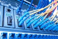 Fiber Optic cables and UTP Network cables connected hub ports.