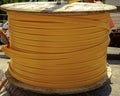 fiber optic cables wires on wooden spool.