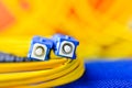 Fiber optic connectors close up on a colourful background. Royalty Free Stock Photo