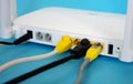 Fiber Optic Internet. Network cables Connected to a router. Wireless internet router with connected cables. Internet security. Royalty Free Stock Photo