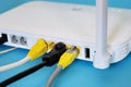 Fiber Optic Internet. Network cables Connected to a router. Wireless internet router with connected cables. Internet security. Royalty Free Stock Photo