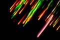 Fiber optic light effects and vibrant light trails. Trails of light swirling chaotically on background Royalty Free Stock Photo