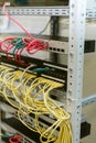 Fiber optic in server room close up. Many wires connect to the network interfaces of powerful Internet servers.  Children`s serve Royalty Free Stock Photo