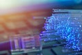 Fiber optics in blue, close up with ethernet and keyboard background, warm lens flare Royalty Free Stock Photo