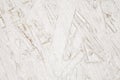 Fiberboard plywood roughly painted with white paint, texture background Royalty Free Stock Photo