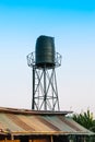 Fiberglass Water Tank Tower in Construction Site Slum of Thailand Royalty Free Stock Photo