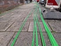 Fibre optic cables ready on the pavement to be buried for high-speed internet Royalty Free Stock Photo