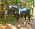 A fibreglass horse in a forest