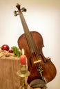 Fiddle to Christmas with candle Royalty Free Stock Photo