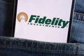 Fidelity Investments logo displayed on smartphone hidden in jeans pocket