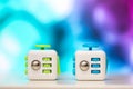 Fidget cube anti stress toy. Detail of finger play toy used for relax. Gadget placed on colorful bokeh background