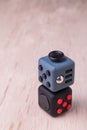 Fidget cube, the stress relieving cube on table top Royalty Free Stock Photo