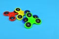 Fidget finger spinner on blue background