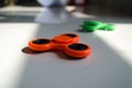 Fidget finger spinner stress, anxiety relief toy on table Royalty Free Stock Photo