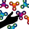 Fidget hand finger spinner stress relieving, colorful toy for removing anxiety and increasing concentration. Royalty Free Stock Photo