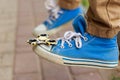 Fidget spinner on the toecap of a sneaker. Game, trendy toys, en