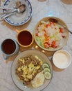 Fied rice wih fried egg, fruit salad and hot tea Royalty Free Stock Photo